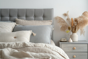 white sofa with pillows, Modern house interior details are showcased in a simple, cozy bedroom setting
