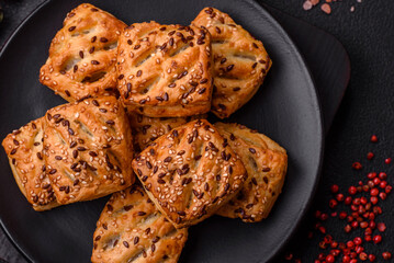Triangular puffs with feta cheese, tomatoes with salt, spices and herbs