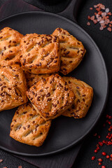 Triangular puffs with feta cheese, tomatoes with salt, spices and herbs