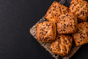 Triangular puffs with feta cheese, tomatoes with salt, spices and herbs