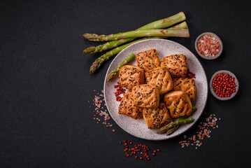 Triangular puffs with feta cheese, tomatoes with salt, spices and herbs
