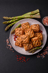 Triangular puffs with feta cheese, tomatoes with salt, spices and herbs