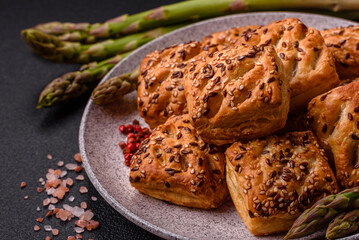 Triangular puffs with feta cheese, tomatoes with salt, spices and herbs