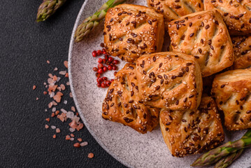 Triangular puffs with feta cheese, tomatoes with salt, spices and herbs