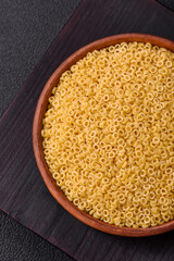 Raw anellini pasta from durum wheat with salt and spices