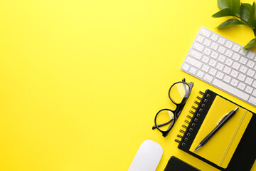 Flat lay composition with office stationery on yellow background, space for text