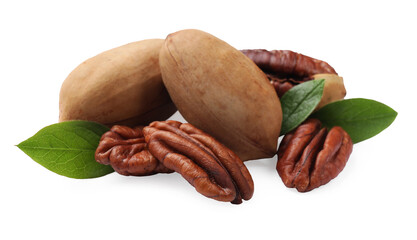 Many tasty pecan nuts with green leaves isolated on white