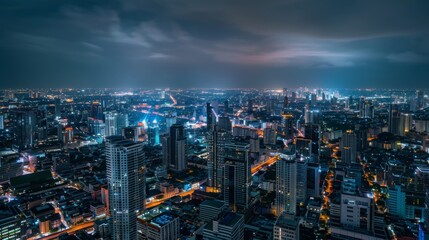 Obraz premium Cityscape Bangkok downtown at night, from the top of BAIYOKE skyscraper, Thailand. and technique long exposure