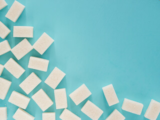 background of white sugar cubes with copy space