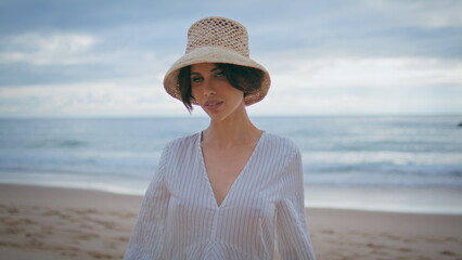 Romantic model walking seashore alone closeup. Beautiful tourist enjoy summer