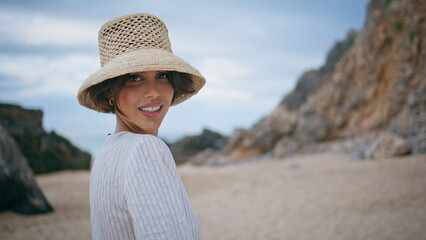 Romantic woman posing ocean shore closeup. Smiling happy tourist resting island