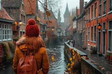 Obraz premium Woman Walking Along River Street