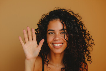 medium body of a latin woman with curly hair,high five  very happy, smiling, on beige isolated backgound, studio light, soft light, pro contrast color grading, dodge burn effec