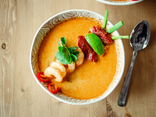 Tom yam kong or Tom yum soup on wooden table