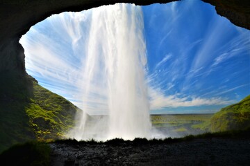 Seljalandsfoss waterfall drops 60 m and is part of the Seljalands river that has its origin in the...
