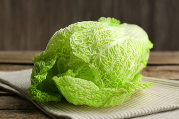 Fresh ripe Chinese cabbage on wooden table, closeup