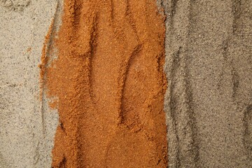 Aromatic spices. Red, black and white pepper powders as background, top view