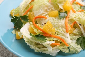 Tasty salad with Chinese cabbage on plate, closeup