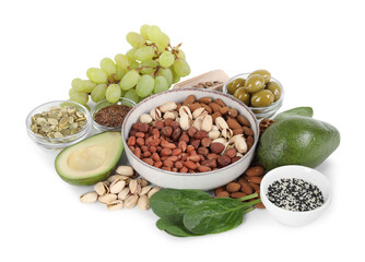 Different nuts, seeds and products high in healthy fats isolated on white