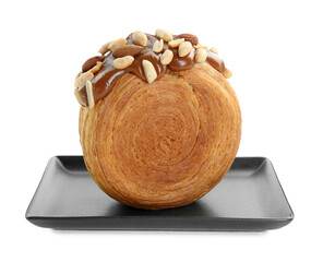 Round croissant with chocolate paste and nuts isolated on white. Tasty puff pastry