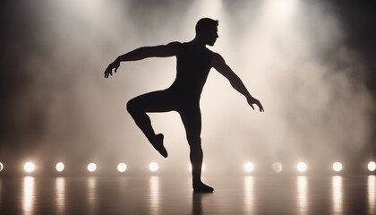silhouette of a male pro ballet dancer in front of spotlights and smoke
