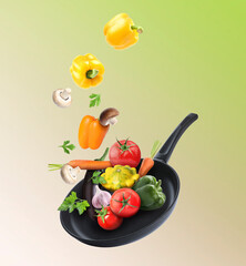 Frying pan and different vegetables in air on color gradient background