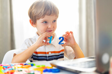 Young Boy Learning Numbers at Home, Engaged in Early Childhood Education