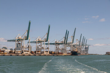 Fototapeta premium Cranes at Port of Miami South Florida Shipping Container Terminal, Miami, Florida, USA