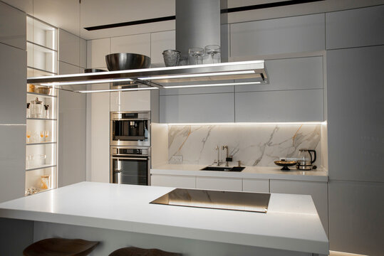 Modern white kitchen with built-in appliances