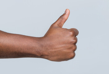 Like gesture. Close-up hand showing thumbs up. Man hands showing thumbs up. Support encourage....