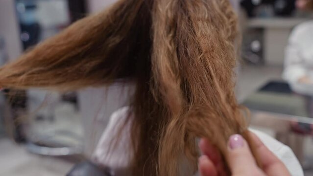 Beauty Session at the Barber Shop: Client Discusses Hair Color and Styling Preferences with Skilled Professional. High quality 4k footage