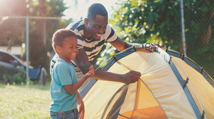 Happy african american son and father pitching tent together in sunny garden summer childhood fatherhood free time camping togetherness and outdoor activities unaltered : Generative AI