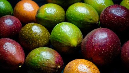 A whole passion fruit close-up creates the texture of the background.