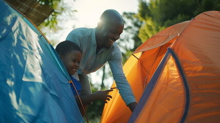 Happy african american son and father pitching tent together in sunny garden summer childhood fatherhood free time camping togetherness and outdoor activities unaltered : Generative AI