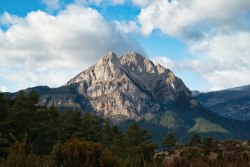 Pedraforca is an emblematic mountain of Catalonia located in the Cadi mountain range. A mountain that has two peaks separated by a large col.  Landscape and background photography in spring.