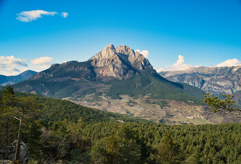 Pedraforca is an emblematic mountain of Catalonia located in the Cadi mountain range. A mountain that has two peaks separated by a large col.  Landscape and background photography in spring.