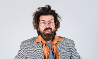 Portrait of stressed and shocked businessman with beard and mustache in glasses. Shocking...