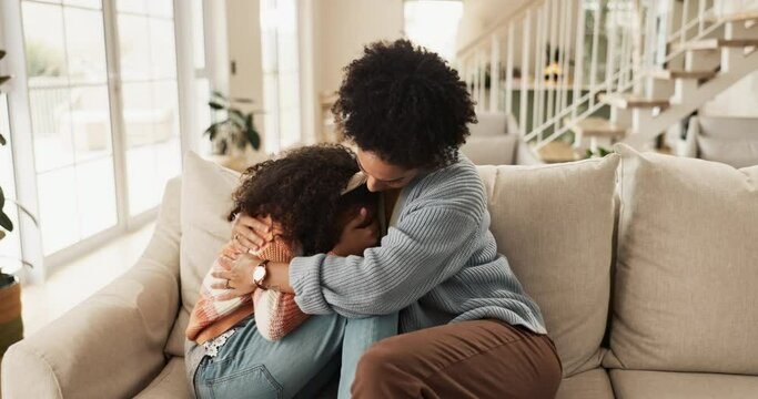Crying, comfort and sad daughter with mother on sofa in living room of home for console or safety. Depression, hug or love with woman single parent and girl child embracing in apartment for support