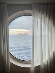 Window view of ship at sea