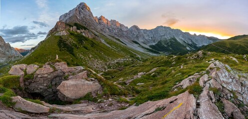 Panorama, alpenglow at the Biegenkoepfen and Wolayerkopf, mountain landscape with green meadows and rocky mountain peaks at sunset, Carnic Alps, Carnic High Trail, Carinthia, Austria, Europe