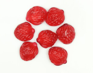Set of red strawberry shaped gummy jelly candies isolated on white background
