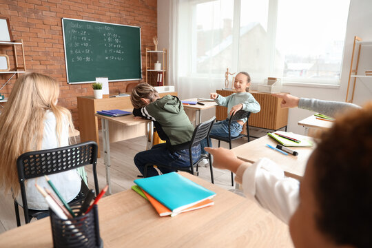 Little children bullying their classmate at school