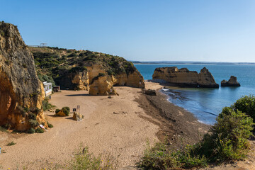 Praia de Dona Ana beach near Lagos town, Algarve, Portugal. Praia Dona Ana beach with turquoise sea water and cliffs, Portugal.