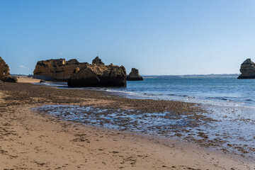 Praia de Dona Ana beach near Lagos town, Algarve, Portugal. Praia Dona Ana beach with turquoise sea water and cliffs, Portugal.