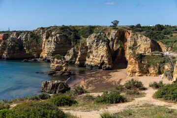 Praia de Dona Ana beach near Lagos town, Algarve, Portugal. Praia Dona Ana beach with turquoise sea water and cliffs, Portugal.