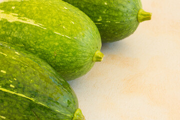 Photograph of fresh green pumpkins.
