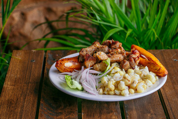 Exquisite Ecuadorian fry with mote, banana and salad