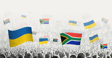 People waving flag of South Africa and Ukraine, symbolizing South Africa solidarity for Ukraine.