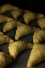 Photograph of empanadas baking. 