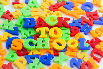 Colorful letters scattered reading Back To School.